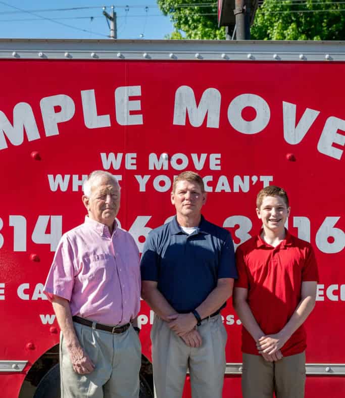 Moving team with a red Simple Moves truck, offering reliable moving services.